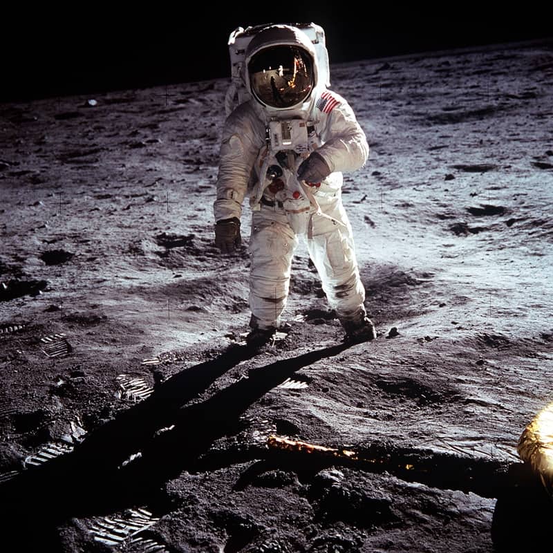 original photo of Apollo 11 astronaut Buzz Aldrin walking on the surface of the moon near the leg of the lunar module Eagle